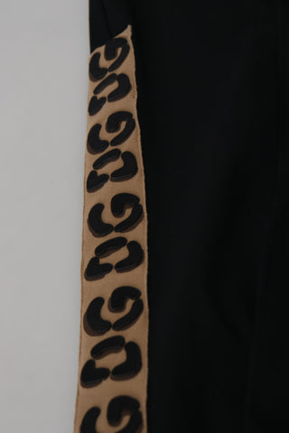 Black cotton elastic waist Dolce & Gabbana cropped pants with DG logo, showcasing a relaxed fit and stylish design.