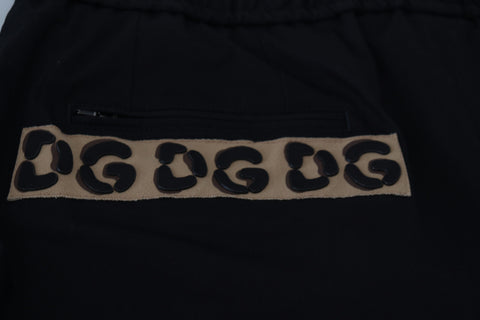 Black cotton elastic waist cropped pants with Dolce & Gabbana DG logo detail, stylish and comfortable fit.