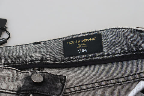 Grey washed cotton slim fit men's denim jeans by Dolce & Gabbana, showing front with pockets and belt loops.