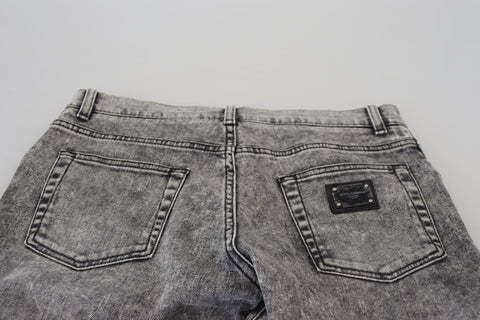 Grey washed cotton slim fit men's denim jeans by Dolce & Gabbana, showcasing a close-up of the fabric and fit.