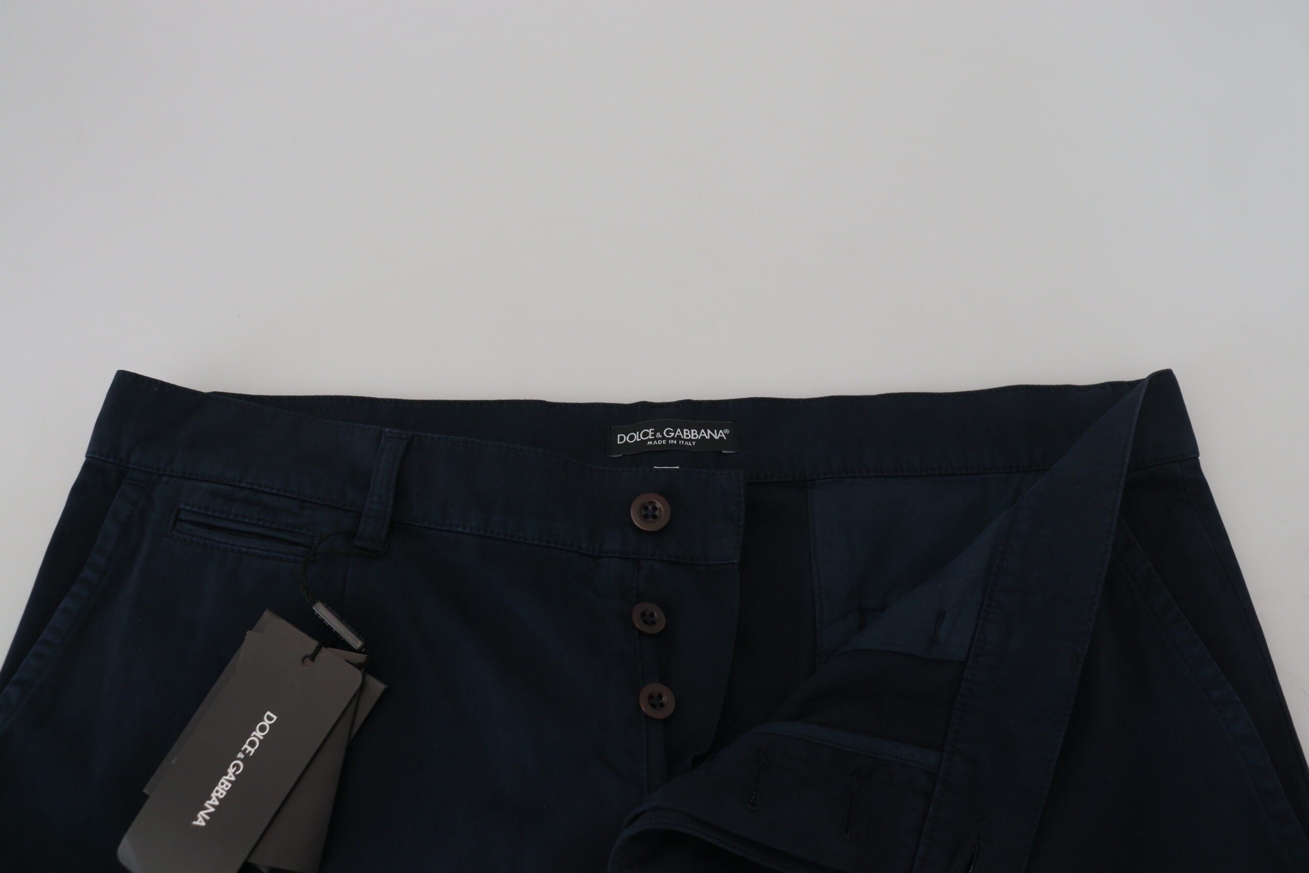 Blue cotton dress shirt and formal men's pants by Dolce & Gabbana, displayed on a neutral background.