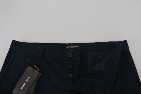Blue cotton dress shirt and formal men's pants by Dolce & Gabbana, displayed on a neutral background.