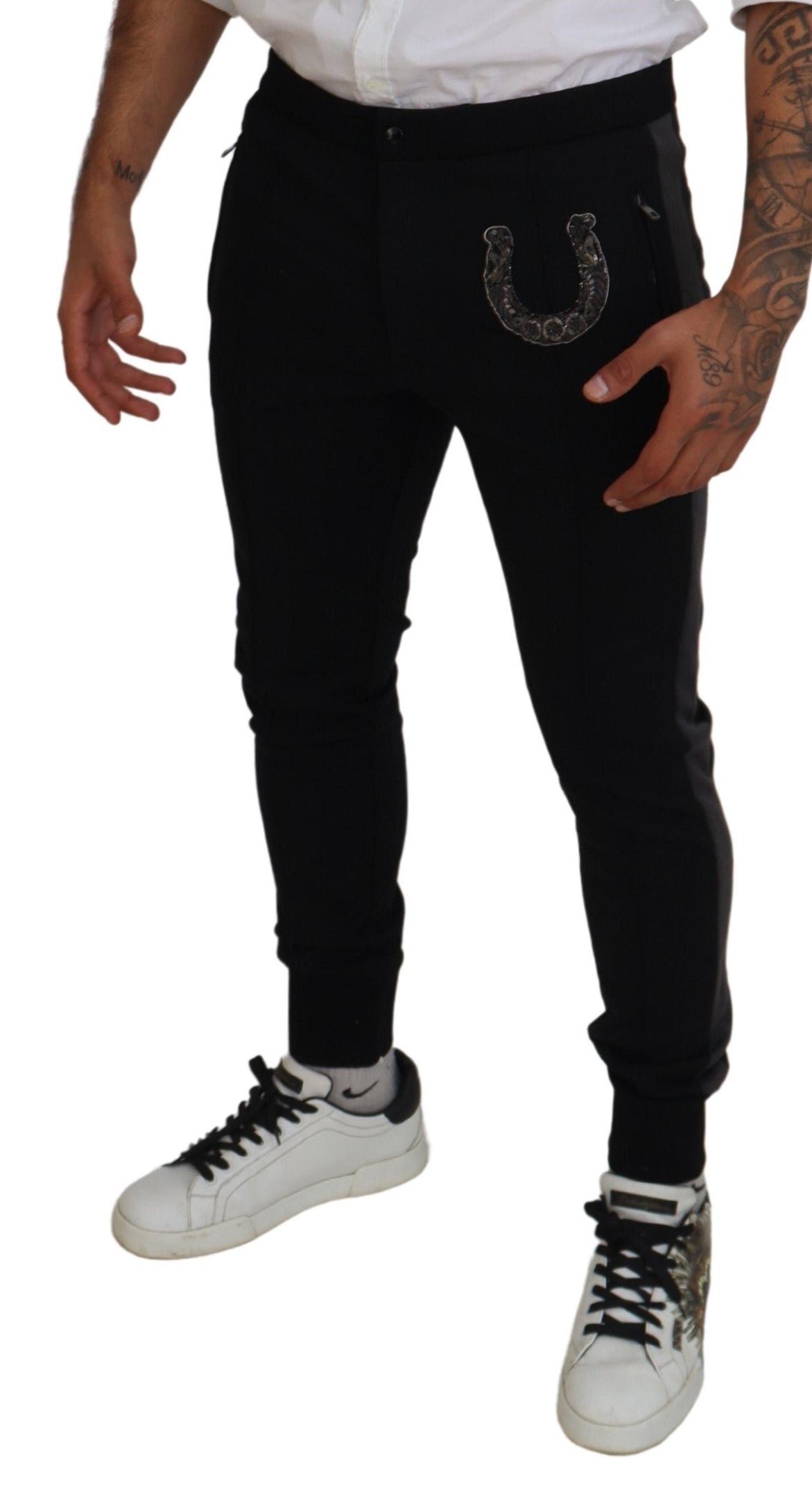 Black wool horseshoe jogger pants by Dolce & Gabbana, featuring a relaxed fit and stylish design with elastic waistband and cuffs.