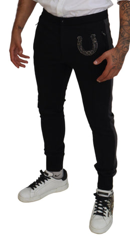 Black wool horseshoe jogger pants by Dolce & Gabbana, featuring a relaxed fit and stylish design with elastic waistband and cuffs.