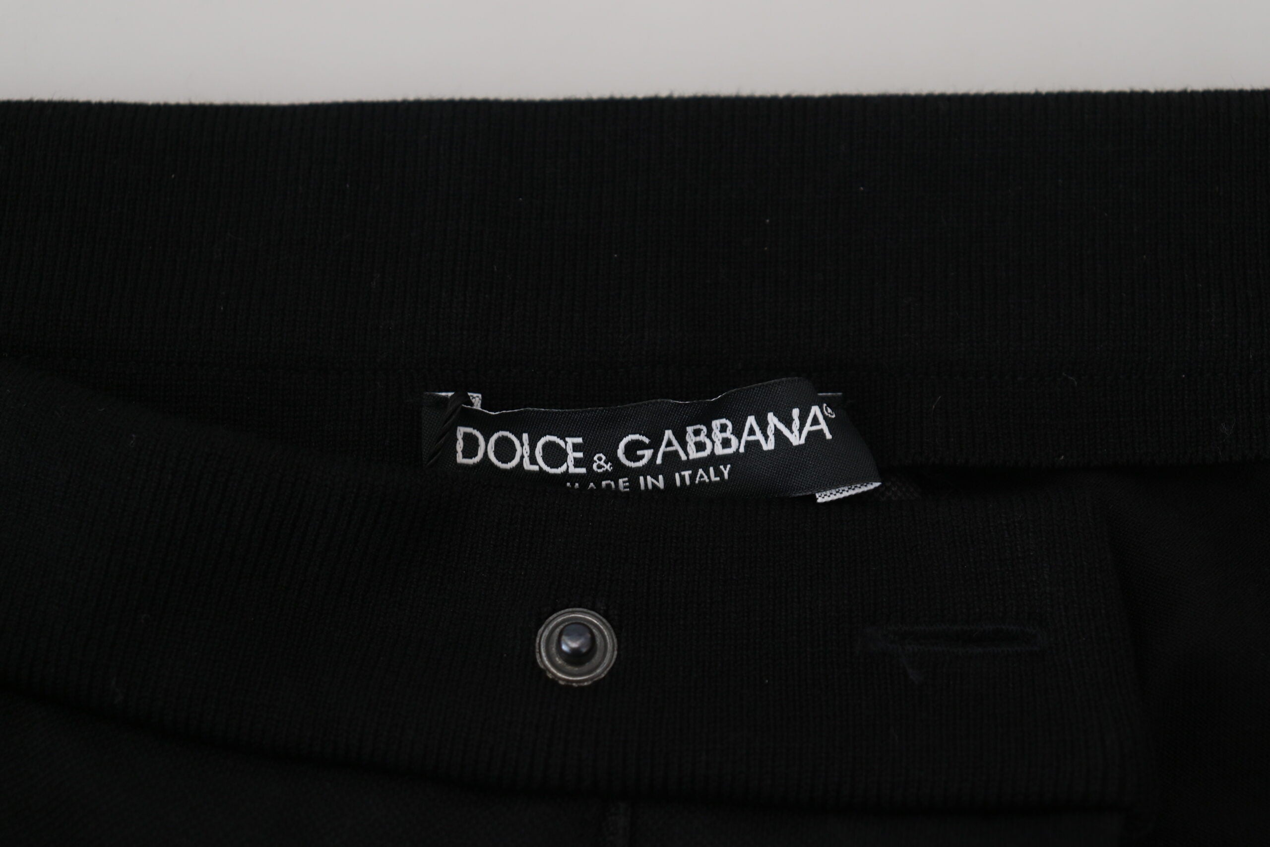 Black wool horseshoe jogger pants by Dolce & Gabbana, featuring a relaxed fit and stylish design.