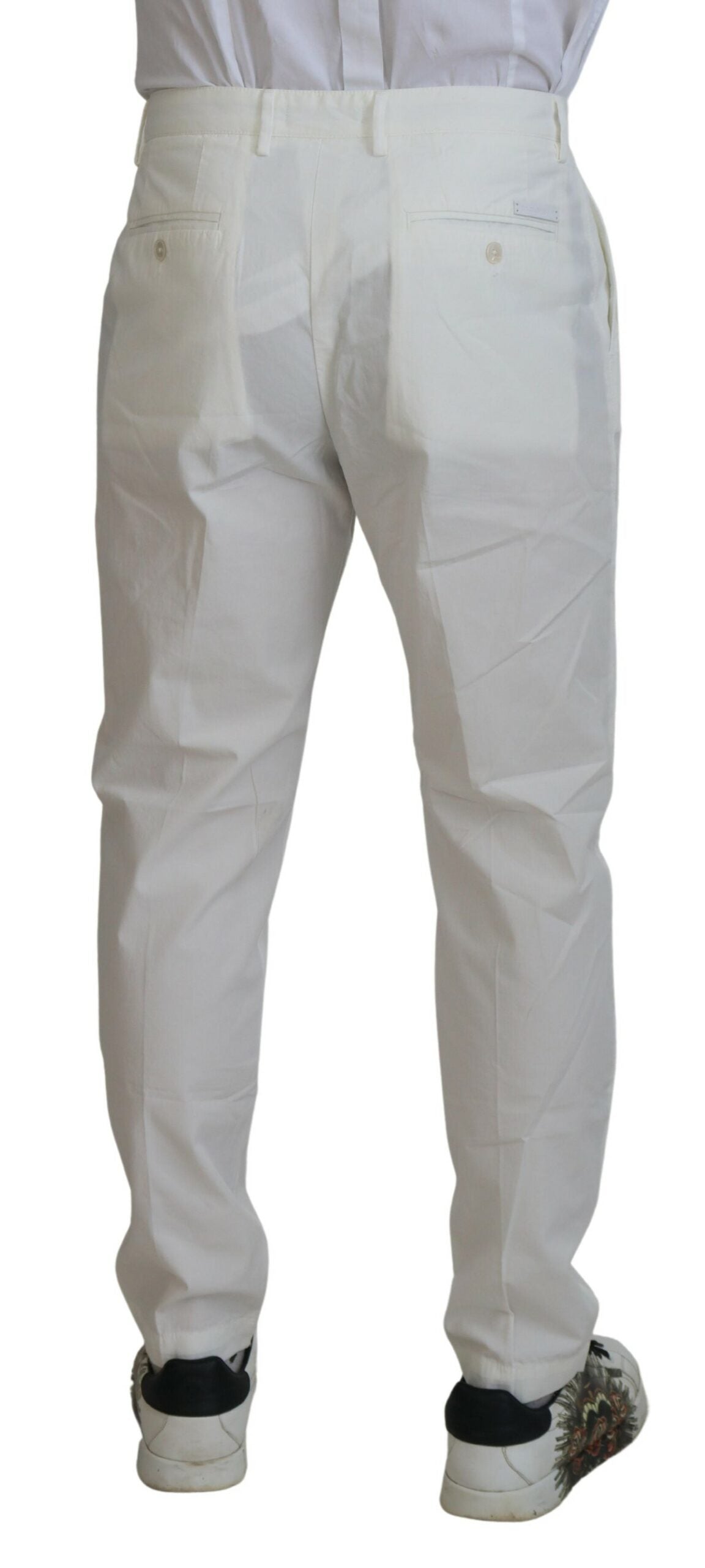 White cotton skinny chino pants by Dolce & Gabbana, fitted style with classic waistband and front pockets.