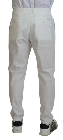 White cotton skinny chino pants by Dolce & Gabbana, fitted style with classic waistband and front pockets.