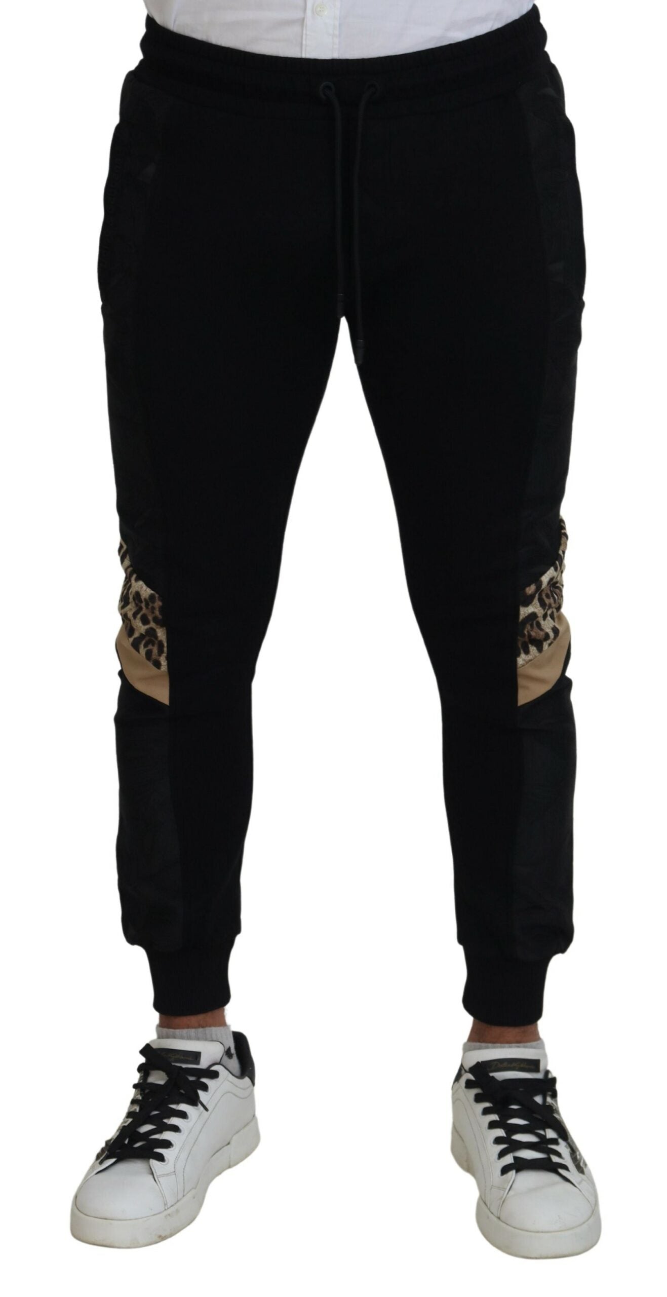 Black polyester skinny jogger pants for men by Dolce & Gabbana, featuring a slim fit and tapered design.