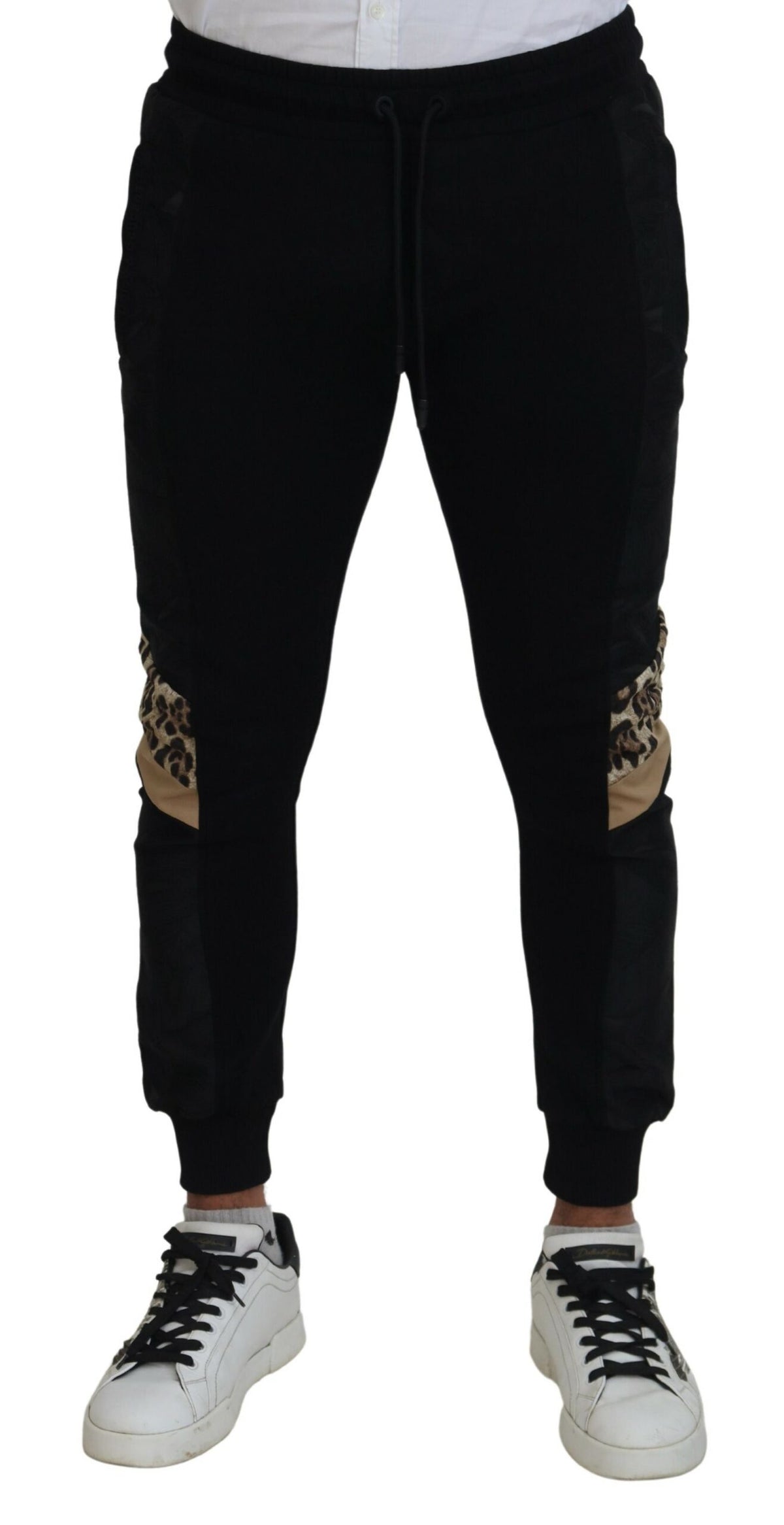 Black polyester skinny jogger pants for men by Dolce & Gabbana, featuring a slim fit and tapered design.