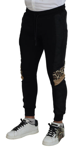 Black polyester skinny jogger pants for men by Dolce & Gabbana, featuring a sleek fitted design and elastic waistband.