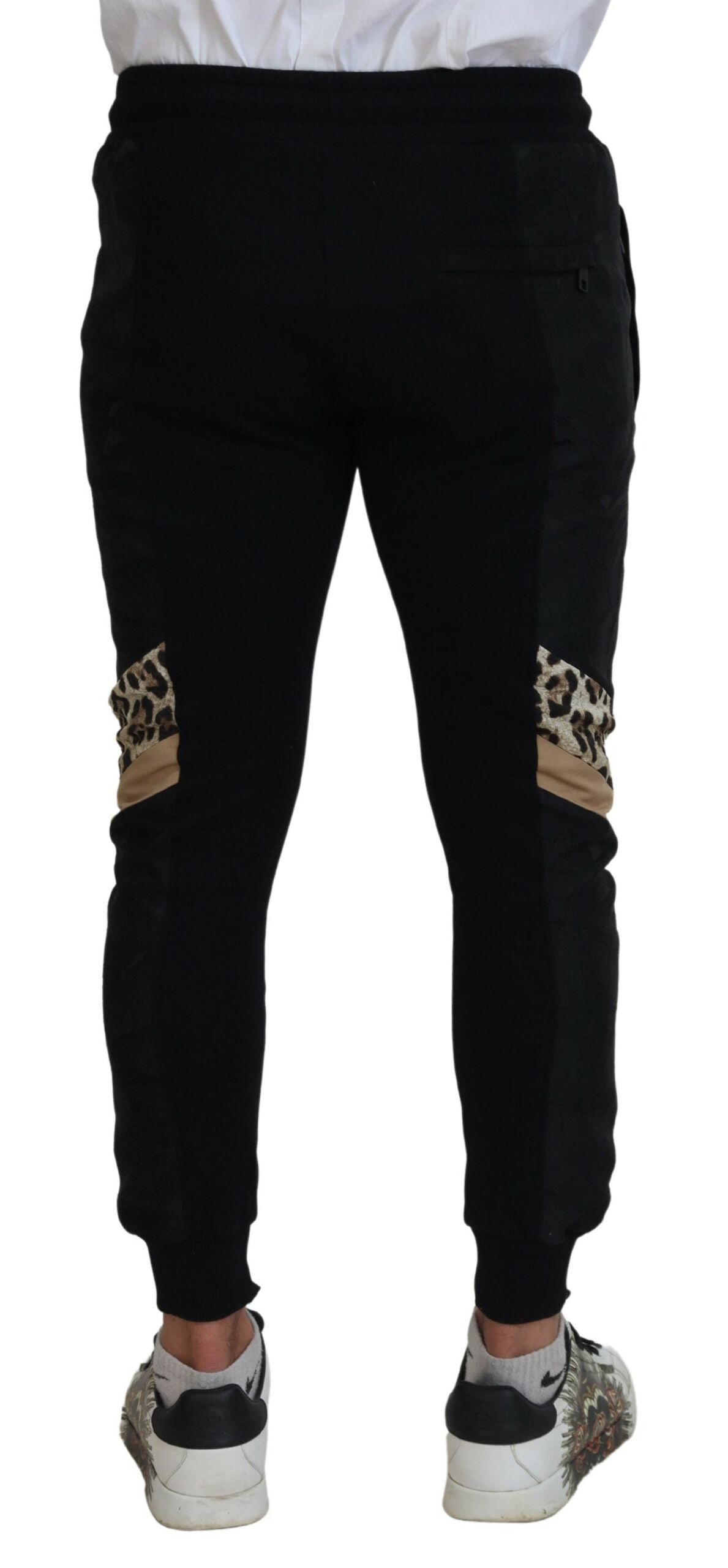 Black polyester skinny jogger pants for men by Dolce & Gabbana, showing fitted style and elastic waistband.