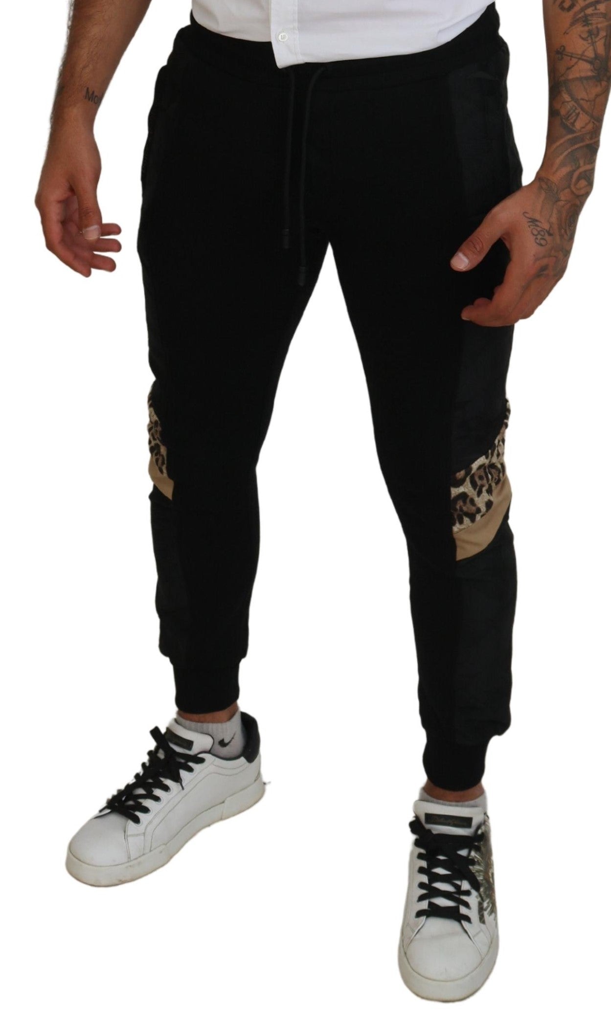 Black polyester skinny jogger pants for men by Dolce & Gabbana, featuring a slim fit and elastic waistband.