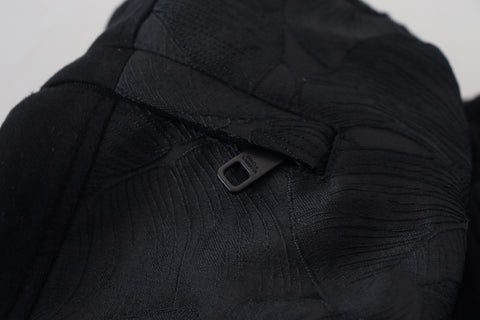 Black polyester skinny jogger pants for men by Dolce & Gabbana, featuring a slim fit design and elastic waistband.