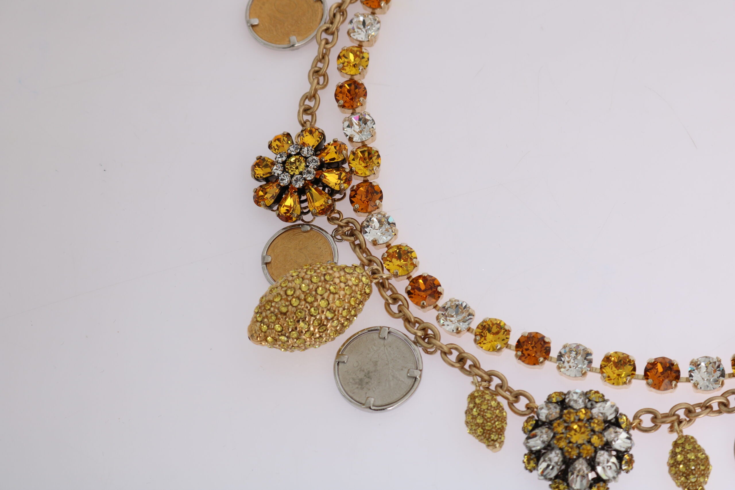 Gold brass pineapple statement necklace with crystal logo detail from Dolce & Gabbana, featuring a bold, decorative pendant.