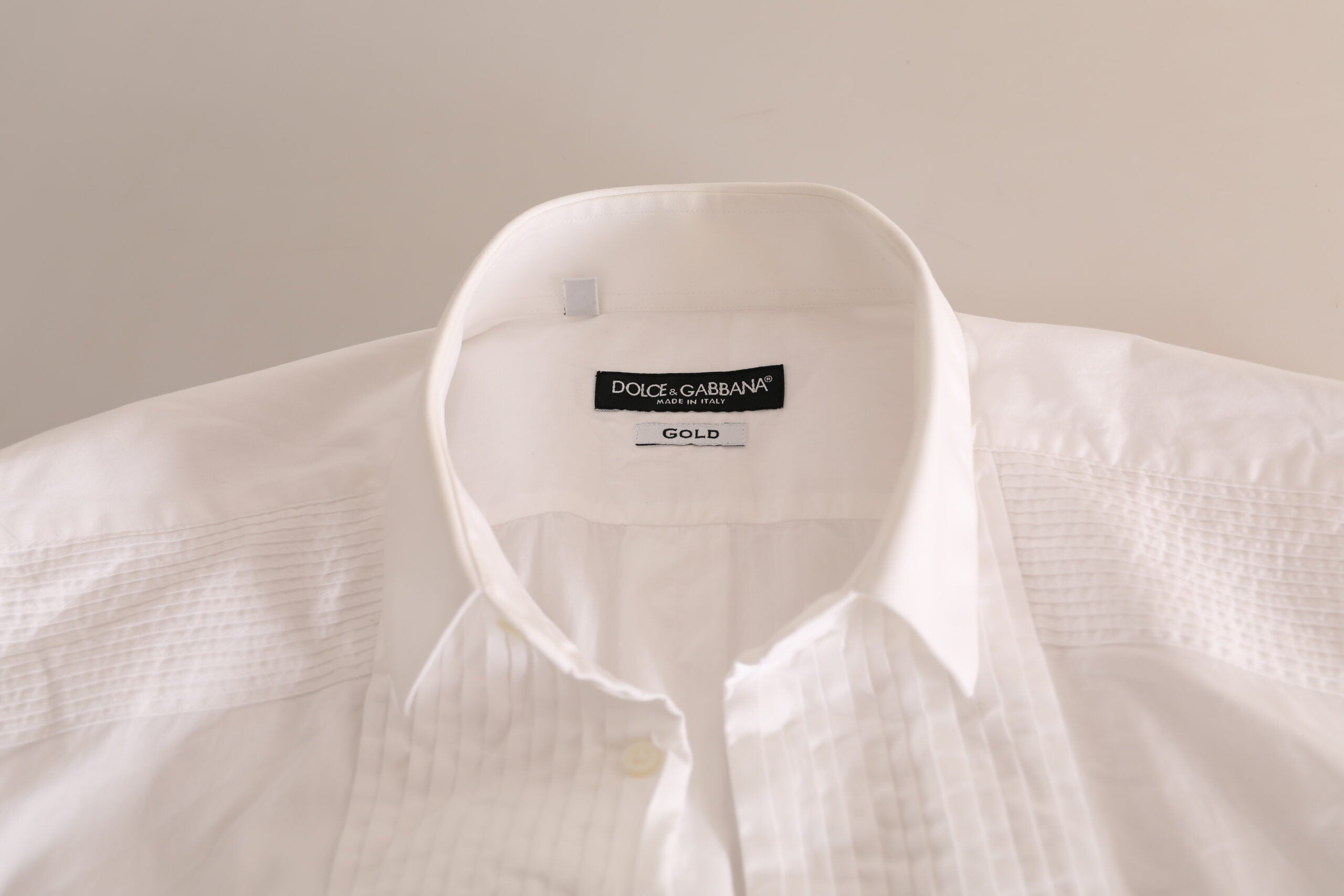 White gold formal cotton tuxedo dress shirt by Dolce & Gabbana, featuring a classic collar and button-front design.