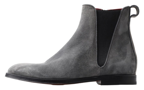 Gray leather men's ankle boots by Dolce & Gabbana with sleek design and sturdy soles, displayed on a neutral background.