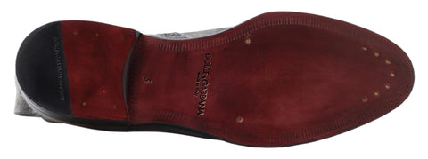 Gray leather men's ankle boots by Dolce & Gabbana featuring sleek design and ankle height, shown from a side view.