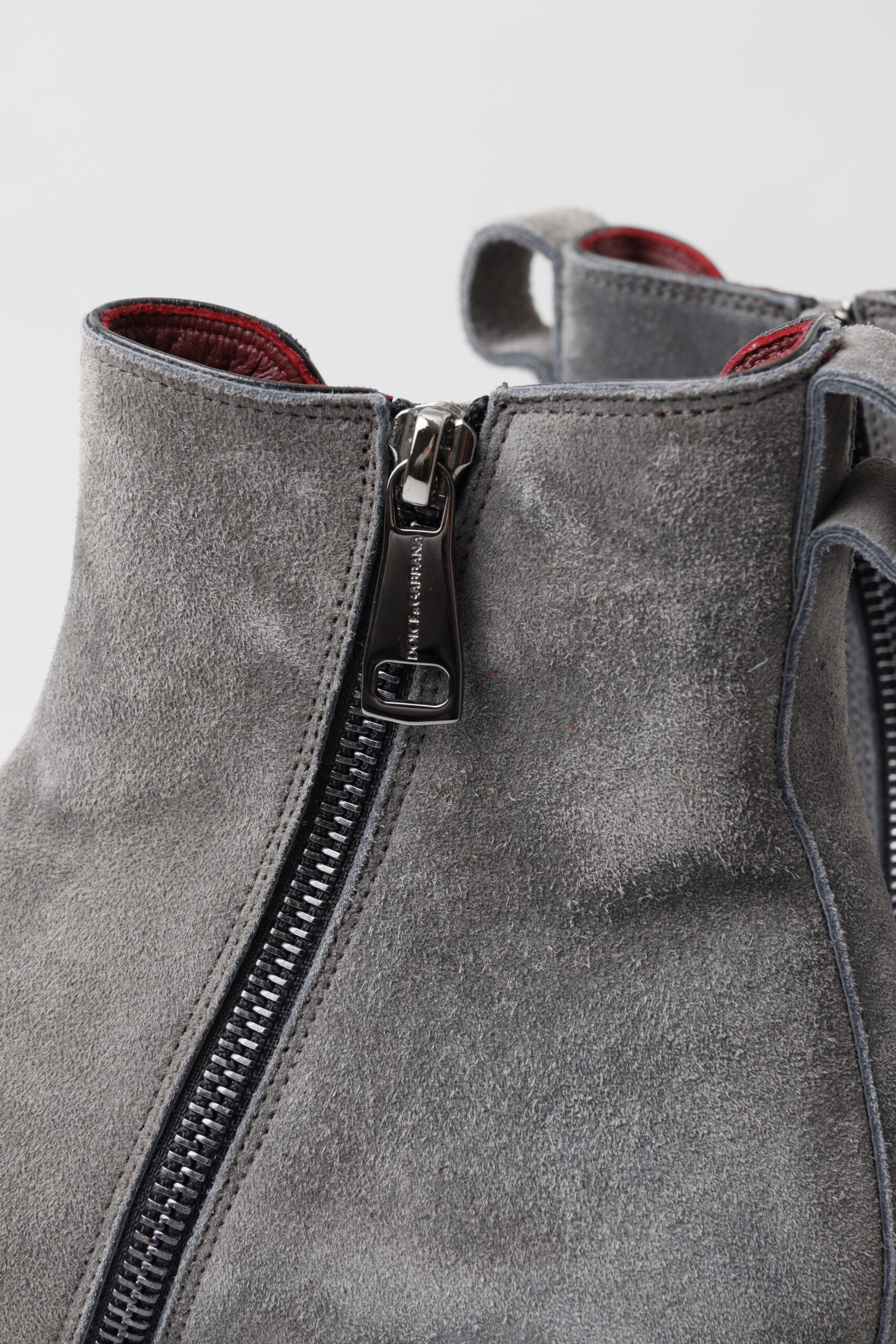 Gray leather men's ankle boots by Dolce & Gabbana with sleek design and sturdy soles, perfect for stylish everyday wear.
