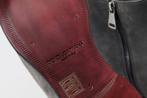 Gray leather men's ankle boots by Dolce & Gabbana with sleek design and sturdy sole, perfect for stylish casual or formal wear.