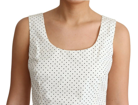 White cotton A-line dress with black polka dots by Dolce & Gabbana, featuring a fitted waist and sleeveless design.