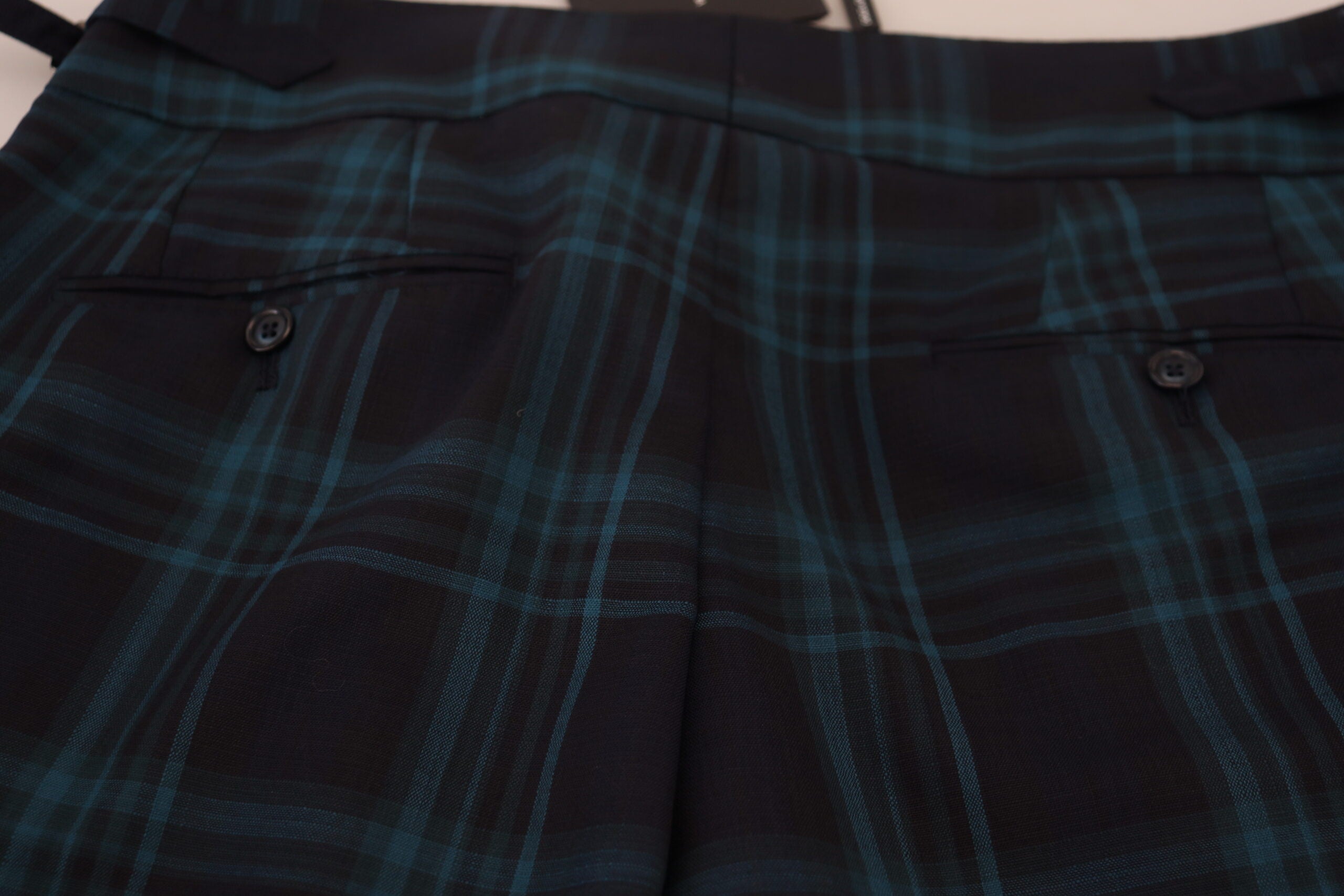 Blue and purple plaid wool trousers by Dolce & Gabbana, featuring tailored fit and classic plaid pattern.