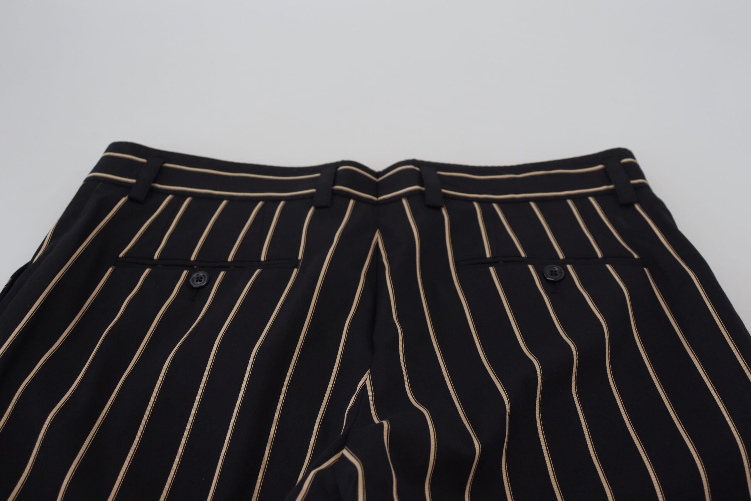 Black and beige striped cotton stretch pants by Dolce & Gabbana, featuring a stylish, fitted design.