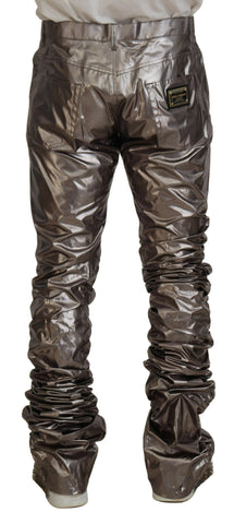 Silver metallic nylon stretch pants by Dolce & Gabbana, showing close-up of fitted, shiny, metallic fabric with waistband and seams.