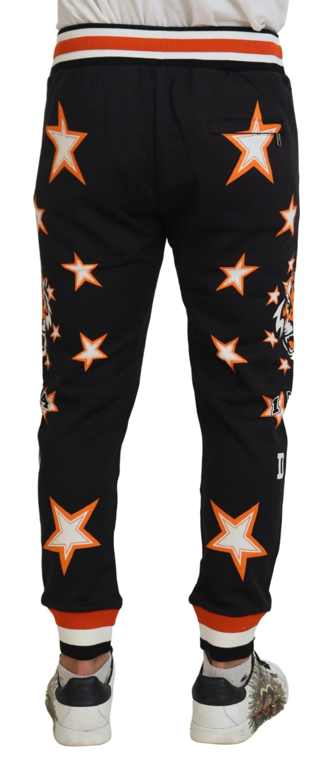 Black and orange star print Dolce & Gabbana sport pants with a relaxed fit and elastic waistband.