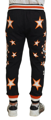 Black and orange star print Dolce & Gabbana sport pants with a relaxed fit and elastic waistband.