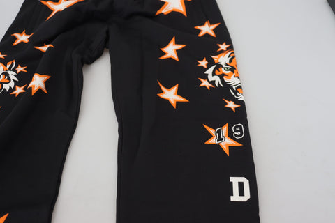 Black and orange star pattern Dolce & Gabbana sport trousers with a relaxed fit and elastic waistband.