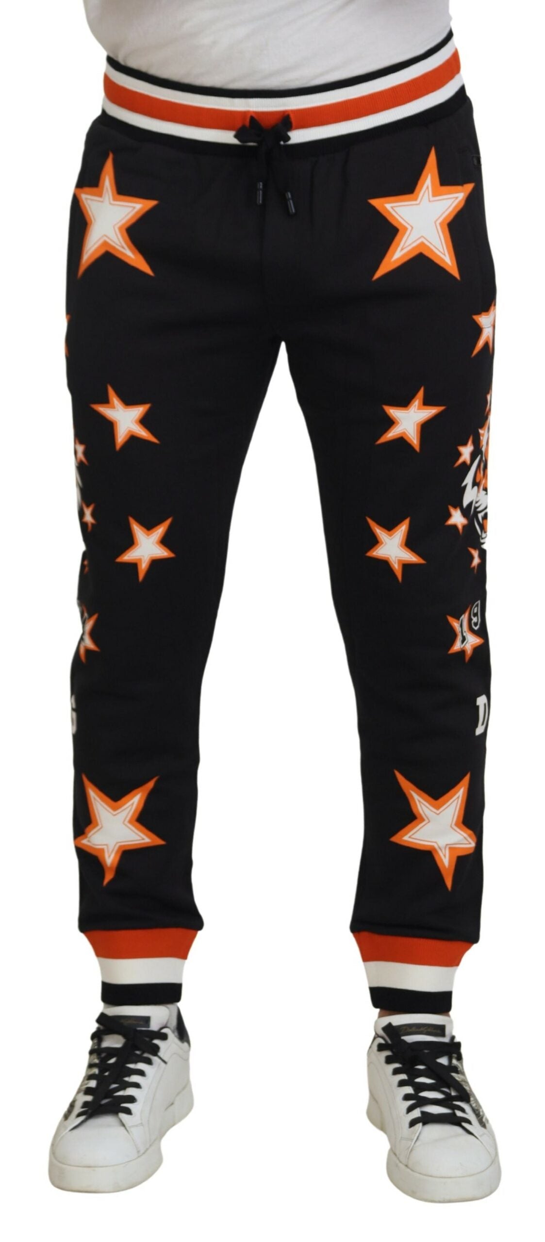 Black and orange star-patterned Dolce & Gabbana sport trousers with a relaxed fit and elastic waistband.