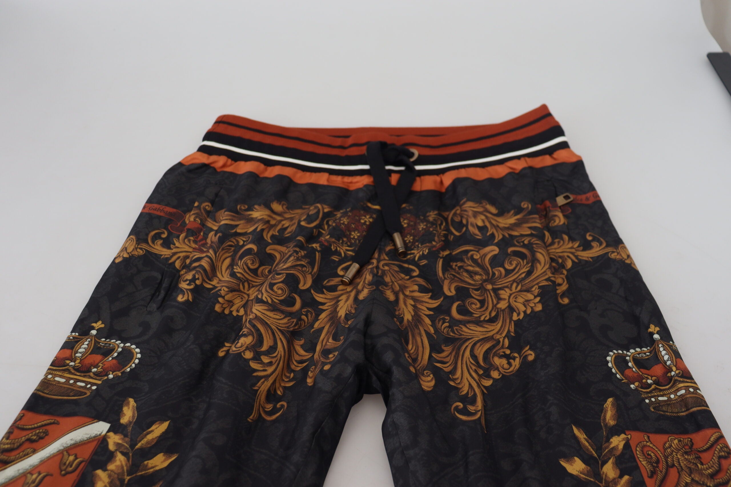 Gray silk Baroque crown trousers by Dolce & Gabbana featuring a luxurious, stylish sport pant design with intricate pattern details.