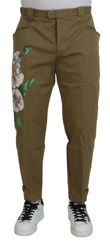 Beige cotton stretch floral chinos pants by Dolce & Gabbana displayed on a model.