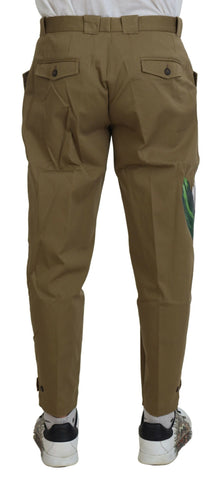 Beige cotton stretch floral chinos pants by Dolce & Gabbana, showing slim fit design and floral pattern details.