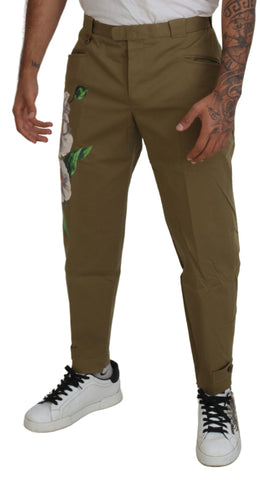 Beige cotton stretch floral chinos pants by Dolce & Gabbana, featuring a stylish fit and floral pattern, shown on a model.