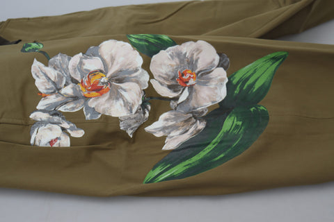 Beige cotton stretch floral chinos pants by Dolce & Gabbana displayed on a model, showcasing sleek fit and floral pattern detail.