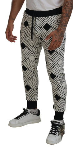 Black and white cotton sport trousers from Dolce & Gabbana, featuring a relaxed fit and athletic style.