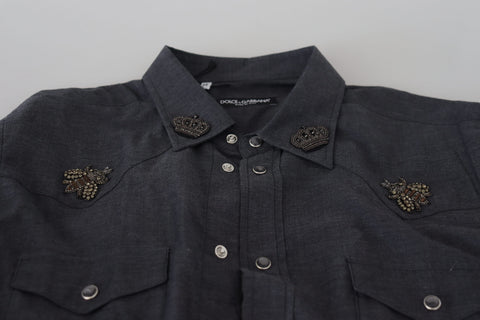 Blue cotton denim shirt by Dolce & Gabbana with crystal bee embroidery and button-down front, casual and stylish for everyday wear.