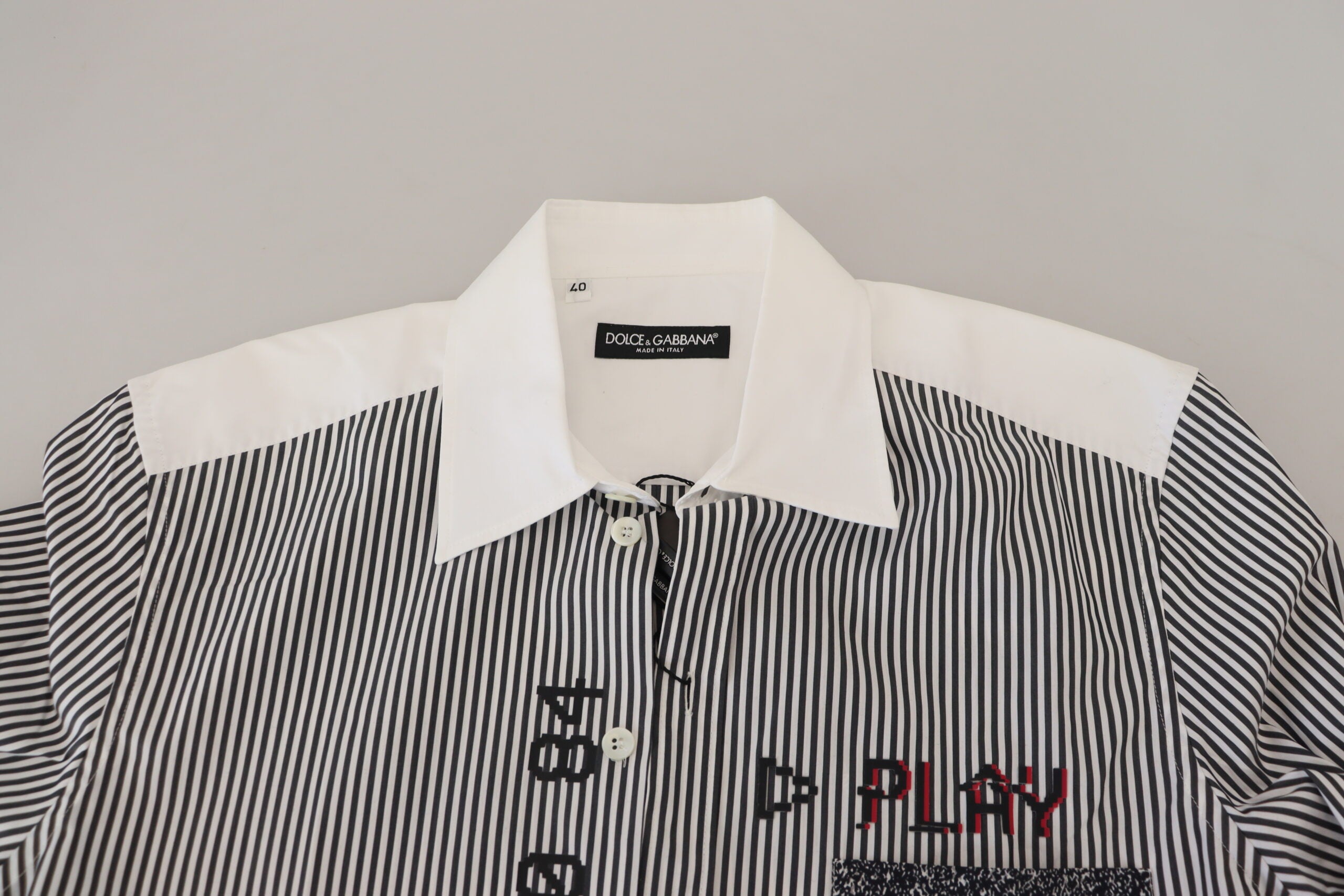Gray and white striped slim fit shirt by Dolce & Gabbana, shown flat with collar and long sleeves.