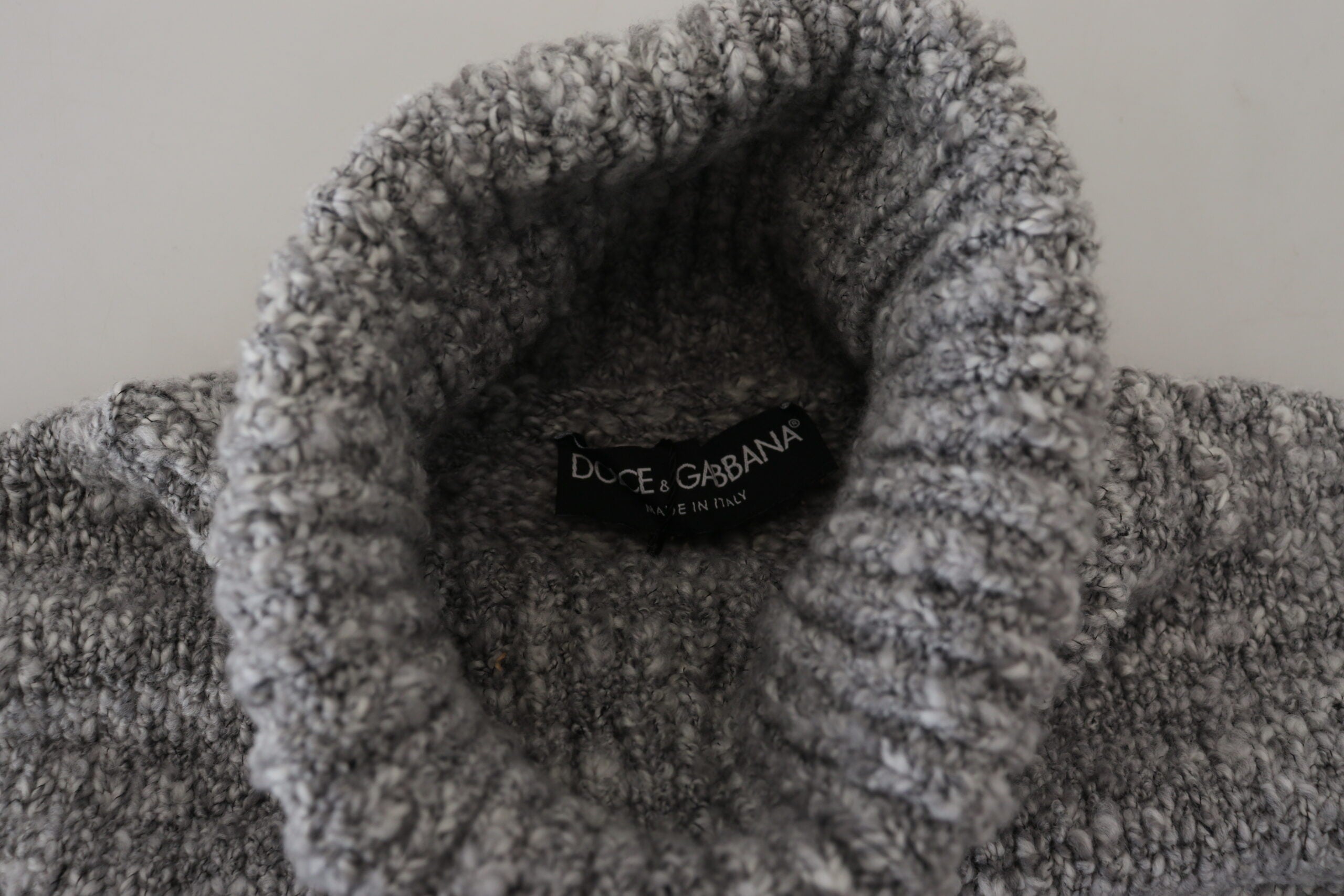 Gray wool knit turtleneck sweater by Dolce & Gabbana, showcasing a cozy, textured knit with a high neckline and long sleeves.