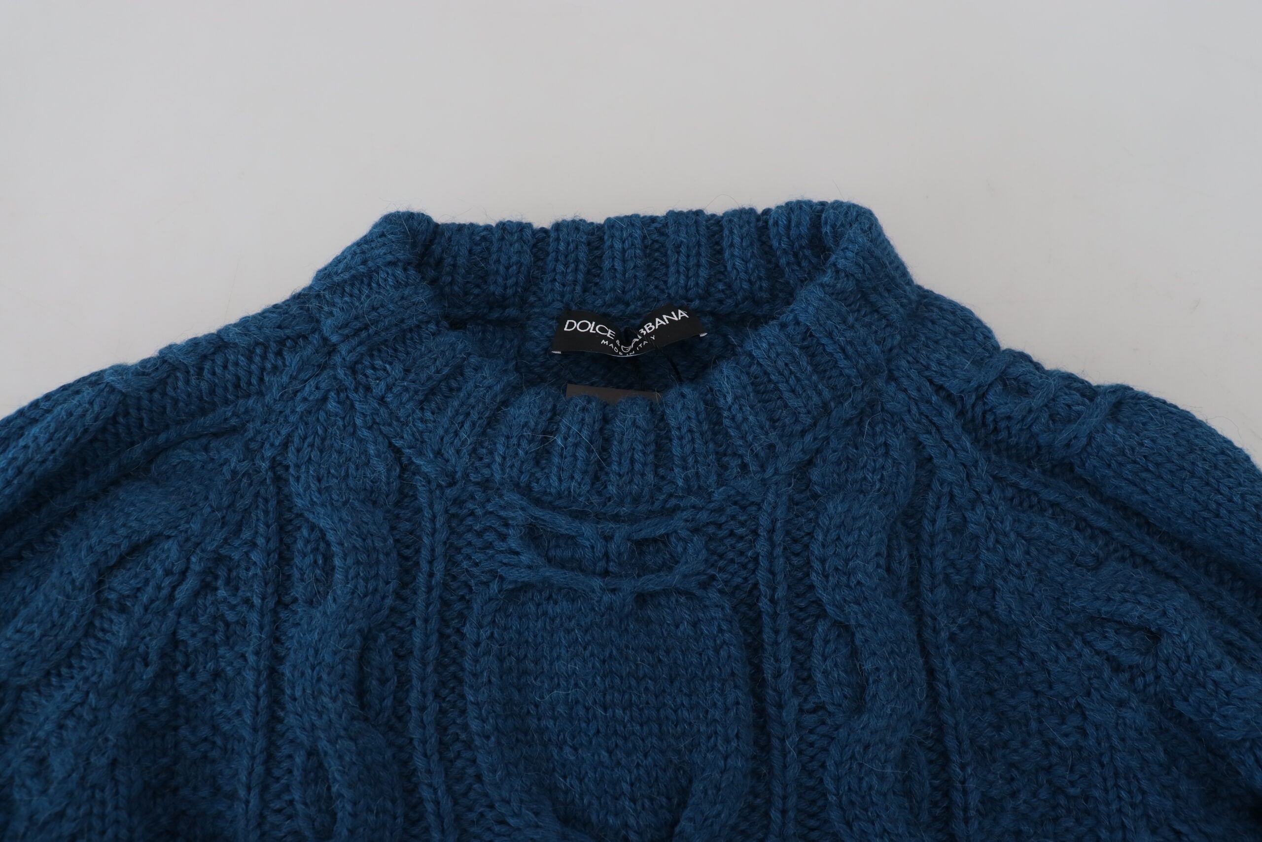 Blue knitted wool alpaca pullover sweater by Dolce & Gabbana, featuring a cozy, textured knit design.