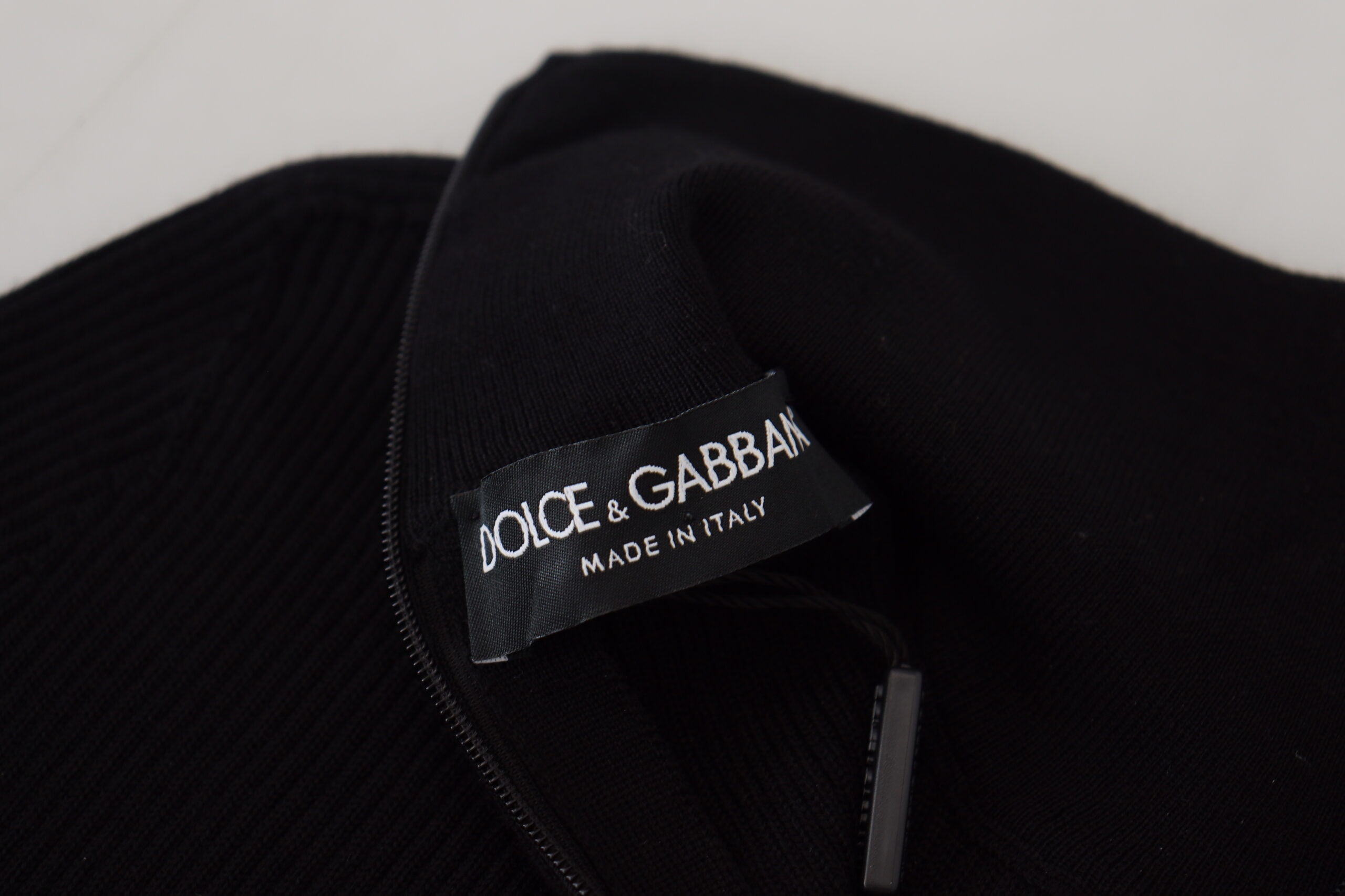 Black Dolce & Gabbana half zip turtleneck pullover sweater displayed on a mannequin.
