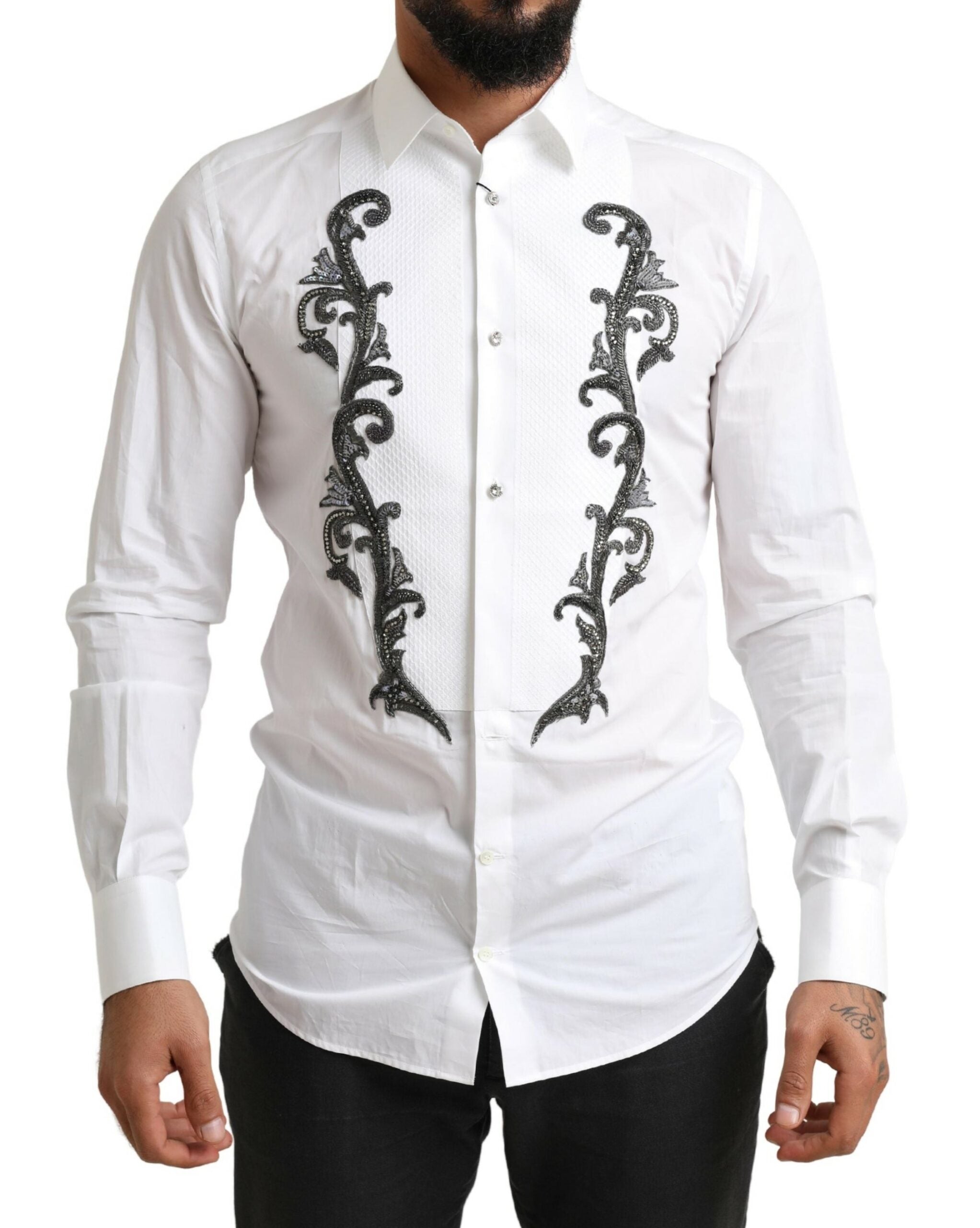 White slim fit Baroque tuxedo shirt by Dolce & Gabbana with intricate patterns and classic collar, displayed on a hanger.