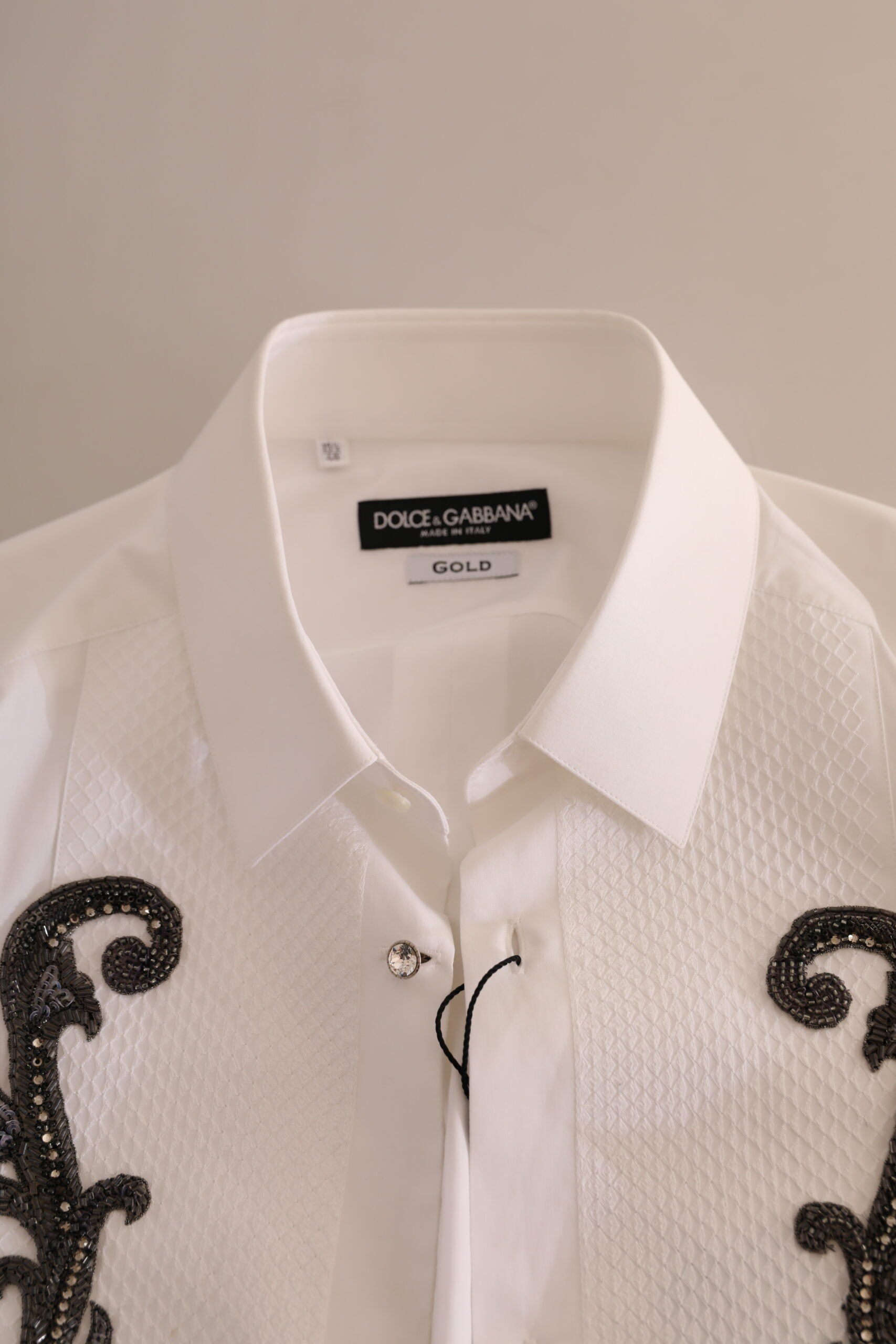White tuxedo slim fit Baroque shirt by Dolce & Gabbana, featuring intricate Baroque pattern and tailored collar.