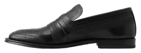 Black leather slipper loafers with stitched detailing from Dolce & Gabbana, featuring a sleek slip-on design and polished finish.