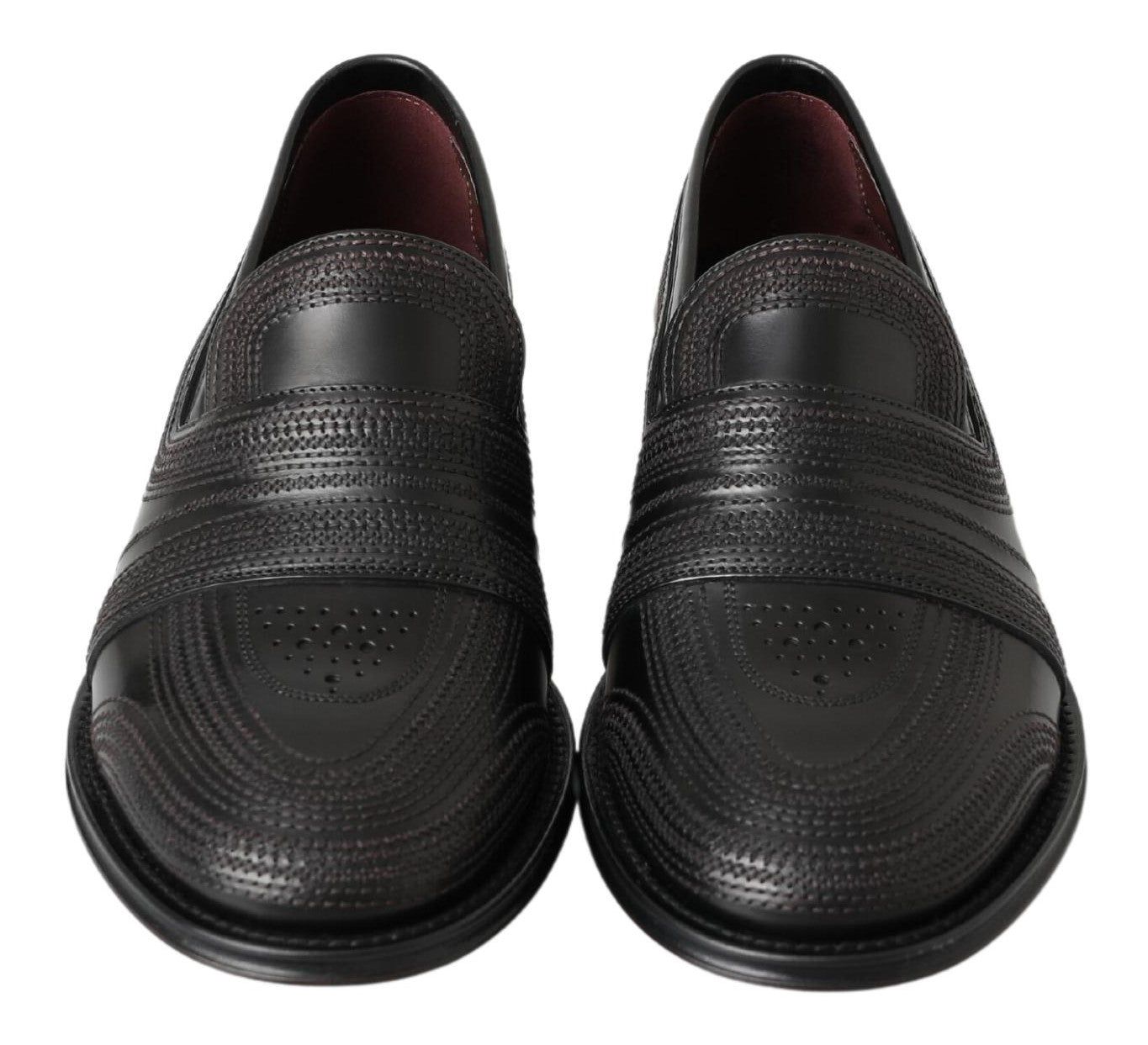 Black leather slipper loafers with stitched detailing from Dolce & Gabbana, featuring a sleek slip-on design.
