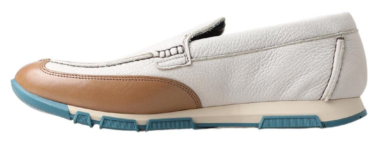White leather loafers by Dolce & Gabbana featuring classic moccasin style and sleek design for elegant footwear.