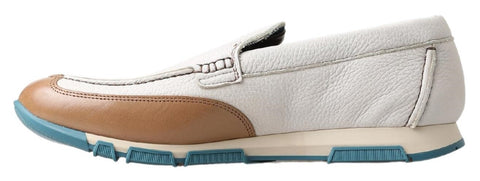 White leather loafers by Dolce & Gabbana featuring classic moccasin style and sleek design for elegant footwear.