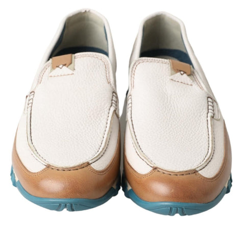 White leather loafers with moccasin-style stitching from Dolce & Gabbana, featuring a sleek, classic design and smooth leather finish.
