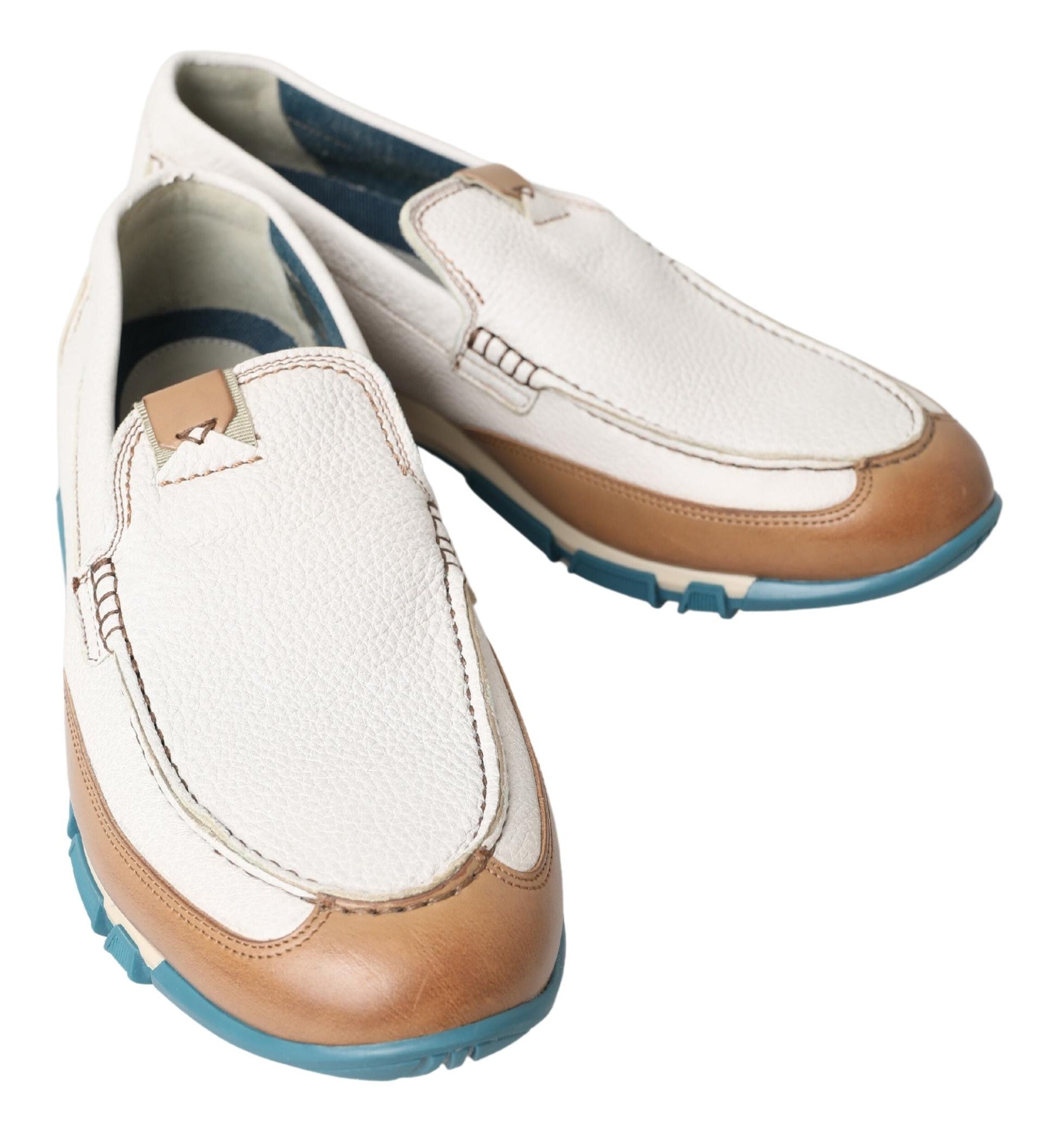 White leather loafers by Dolce & Gabbana featuring classic moccasin style, with smooth finish and slip-on design.